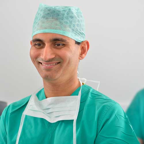 Mr Sanjay Mantry preparing for cataract surgery in scrubs
